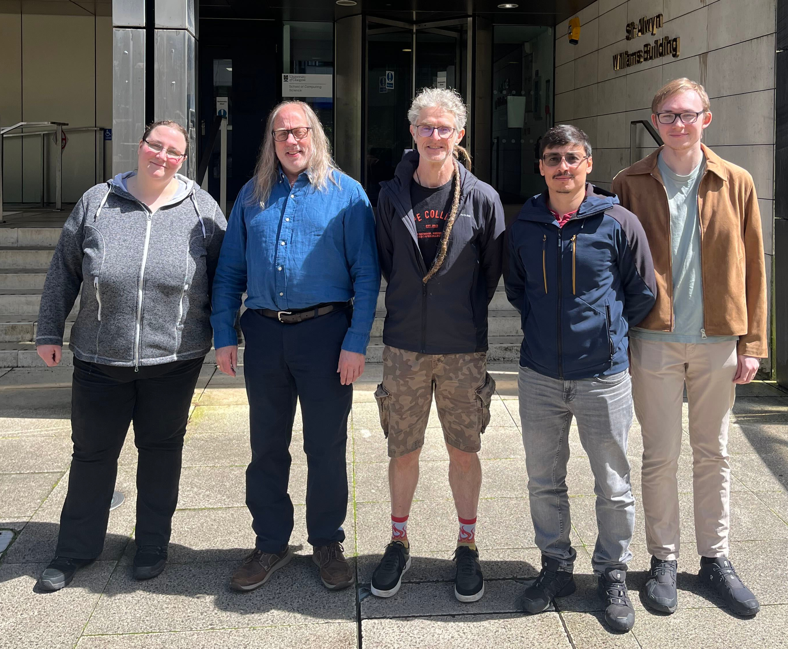 A group of five people in front ofthe school of computing science, from left to right: Patrizia, Frank, Stephen, Andres and Stephen H